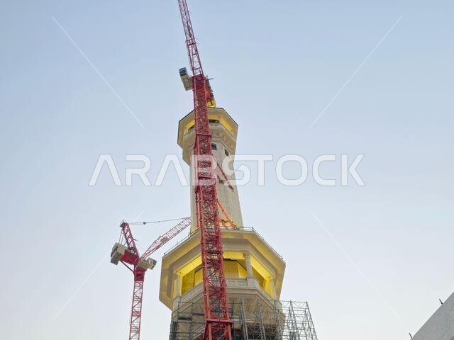 Mecca, Saudi Arabia, June 4 2024: Minarets of Al Masjid Al Haram mosque around the Kaaba in Hajj, pilgrimage, Umrah, with crane towers around it for m Mecca, Saudi Arabia, June 4 2024: Minarets of Al Masjid Al Haram mosque around the Kaaba in Hajj, pilgrimage, Umrah, with crane towers around it for m