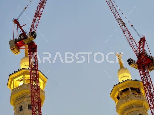 Mecca, Saudi Arabia, June 4 2024: Minarets of Al Masjid Al Haram mosque around the Kaaba in Hajj, pilgrimage, Umrah, with crane towers around it for m