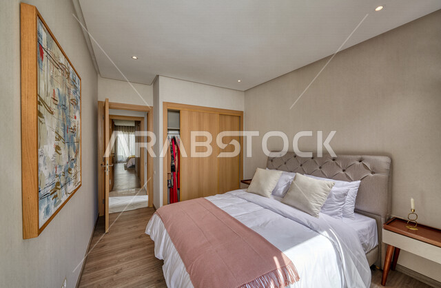 صورة لغرفة نوم في شقة سكنية بتصاميم عصرية و جذابة ، ديكورات رائعة ، أثاث منزلي راقي ، تصاميم فخمة و جميلة ، شقق سكنية سياحية ، أوتيل ، فنادق فاخرة