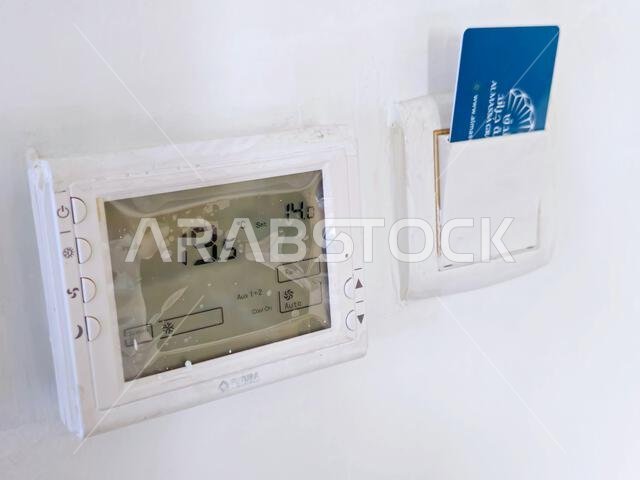 Mecca, Saudi Arabia, June 5 2024: Al Masa grand hotel electronic key in place to activate the services and lights of the room and the air conditioning