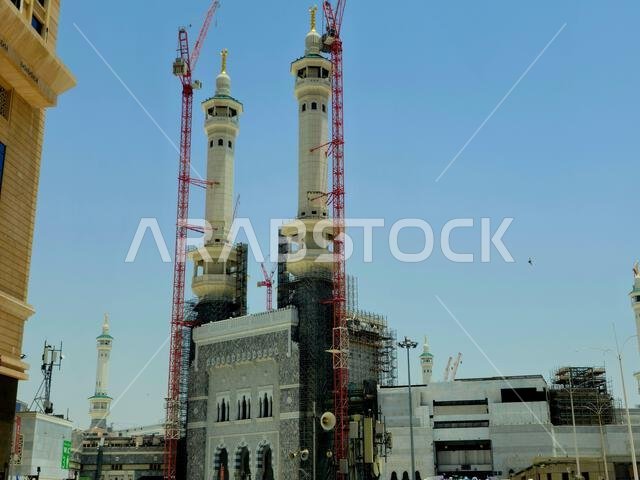 Mecca, Saudi Arabia, June 5 2024: Minarets of Al Masjid Al Haram mosque around the Kaaba in Hajj, pilgrimage, Umrah, with crane towers around it for m