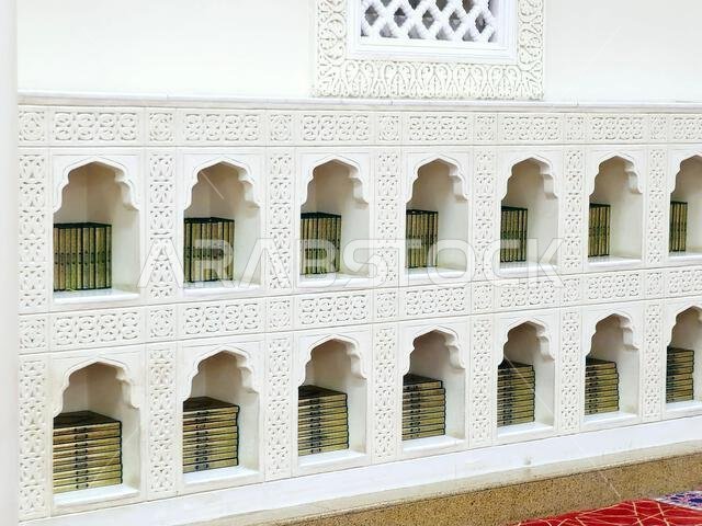 Quran books inside The Masjid Al Qiblatayn Mosque of the Two Qiblas, contained two mihrabs (niches indicating the qibla) in different directions, Qibl