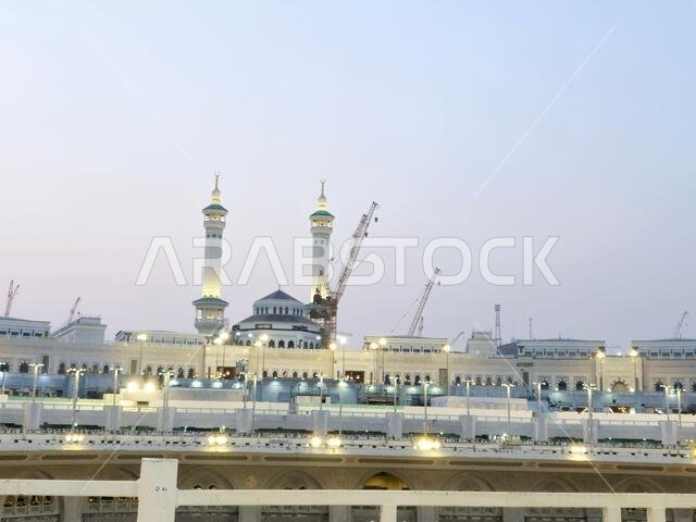 Mecca, Saudi Arabia, June 5 2024: Minarets of Al Masjid Al Haram mosque around the Kaaba in Hajj, pilgrimage, Umrah, with crane towers around it for m
