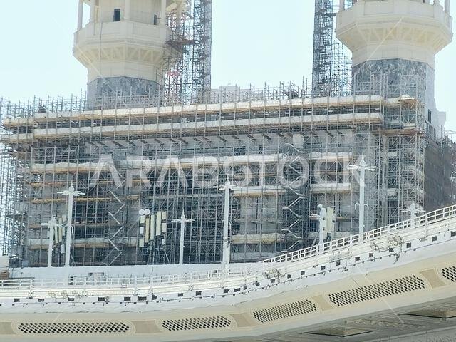 Mecca, Saudi Arabia, June 4 2024: Minarets of Al Masjid Al Haram mosque around the Kaaba in Hajj, pilgrimage, Umrah, with crane towers around it for m