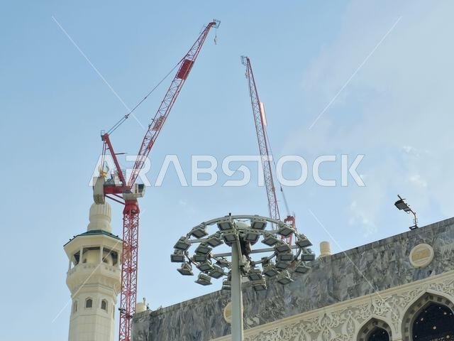Mecca, Saudi Arabia, June 5 2024: Minarets of Al Masjid Al Haram mosque around the Kaaba in Hajj, pilgrimage, Umrah, with crane towers around it for m