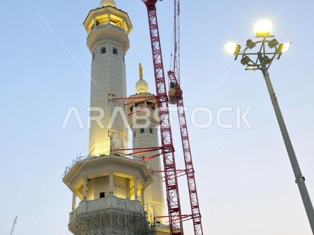 Mecca, Saudi Arabia, June 4 2024: Minarets of Al Masjid Al Haram mosque around the Kaaba in Hajj, pilgrimage, Umrah, with crane towers around it for m Mecca, Saudi Arabia, June 4 2024: Minarets of Al Masjid Al Haram mosque around the Kaaba in Hajj, pilgrimage, Umrah, with crane towers around it for m