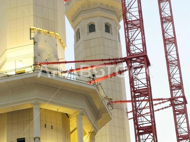 Mecca, Saudi Arabia, June 4 2024: Minarets of Al Masjid Al Haram mosque around the Kaaba in Hajj, pilgrimage, Umrah, with crane towers around it for m