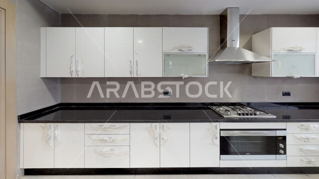 تصميم داخلي لمطبخ داخل شقة في مجمع سكني فاخر، شقق سكنية سياحية، تصاميم وديكورات داخلية، تصميم معماري هندسي حديث، الهندسة المعمارية في المملكة العربية السعودية،  تصميم معماري هندسي حديث