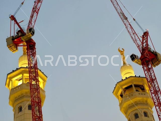 Mecca, Saudi Arabia, June 4 2024: Minarets of Al Masjid Al Haram mosque around the Kaaba in Hajj, pilgrimage, Umrah, with crane towers around it for m