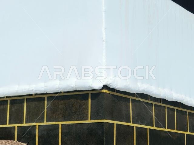 Kabaa in Ihram clothing, The Kaaba a stone building at the center of Islam's most important mosque and holiest site, the Masjid al-Haram, It's the Qib