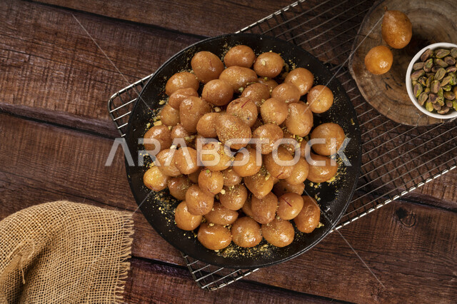 Delicious dumplings dish, oriental sweets, sweets and sugars, delicious desserts, desserts, delicious and delicious desserts, dumplings dessert, delicious dessert recipes and dishes, restaurants for oriental Arab food