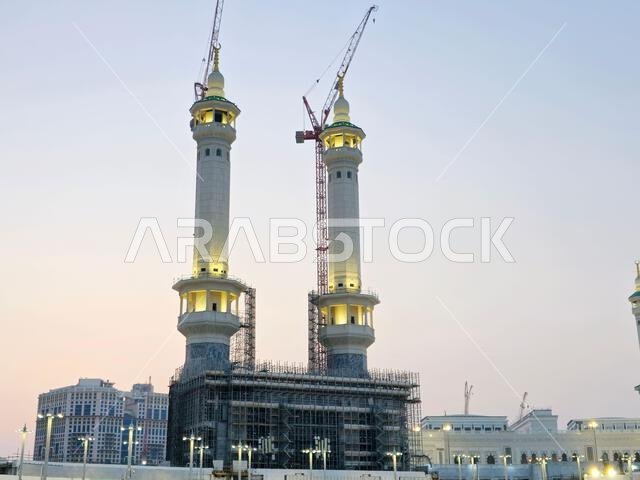 Mecca, Saudi Arabia, June 5 2024: Minarets of Al Masjid Al Haram mosque around the Kaaba in Hajj, pilgrimage, Umrah, with crane towers around it for m