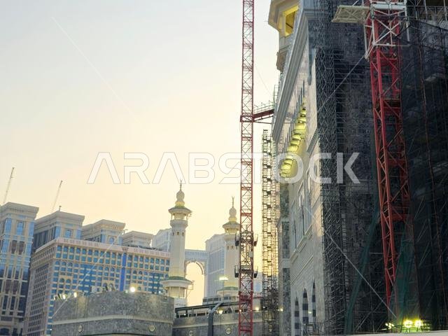 Mecca, Saudi Arabia, June 4 2024: Minarets of Al Masjid Al Haram mosque around the Kaaba in Hajj, pilgrimage, Umrah, with crane towers around it for m