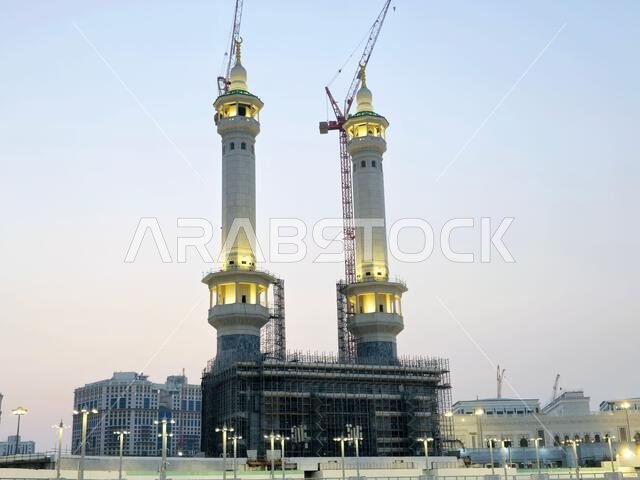 Mecca, Saudi Arabia, June 5 2024: Minarets of Al Masjid Al Haram mosque around the Kaaba in Hajj, pilgrimage, Umrah, with crane towers around it for m