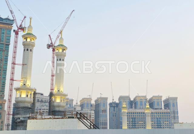 Mecca, Saudi Arabia, June 4 2024: Minarets of Al Masjid Al Haram mosque around the Kaaba in Hajj, pilgrimage, Umrah, with crane towers around it for m