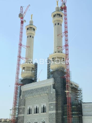 Mecca, Saudi Arabia, June 4 2024: Minarets of Al Masjid Al Haram mosque around the Kaaba in Hajj, pilgrimage, Umrah, with crane towers around it for m