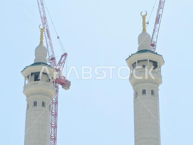 Mecca, Saudi Arabia, June 4 2024: Minarets of Al Masjid Al Haram mosque around the Kaaba in Hajj, pilgrimage, Umrah, with crane towers around it for m