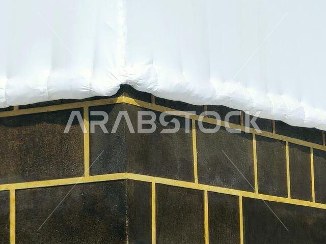 Kabaa in Ihram clothing, The Kaaba a stone building at the center of Islam's most important mosque and holiest site, the Masjid al-Haram, It's the Qib