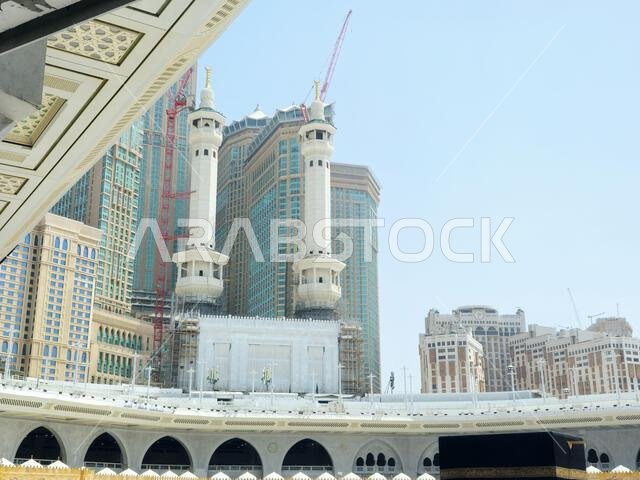 Mecca, Saudi Arabia, June 4 2024: Minarets of Al Masjid Al Haram mosque around the Kaaba in Hajj, pilgrimage, Umrah, with crane towers around it for m