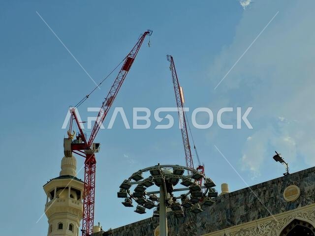 Mecca, Saudi Arabia, June 5 2024: Minarets of Al Masjid Al Haram mosque around the Kaaba in Hajj, pilgrimage, Umrah, with crane towers around it for m