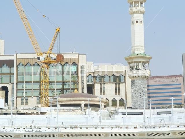 Mecca, Saudi Arabia, June 4 2024: Minarets of Al Masjid Al Haram mosque around the Kaaba in Hajj, pilgrimage, Umrah, with crane towers around it for m