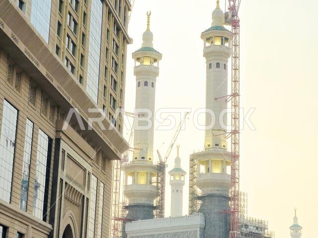 Mecca, Saudi Arabia, June 4 2024: Minarets of Al Masjid Al Haram mosque around the Kaaba in Hajj, pilgrimage, Umrah, with crane towers around it for m