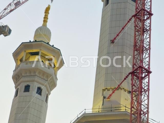 Mecca, Saudi Arabia, June 4 2024: Minarets of Al Masjid Al Haram mosque around the Kaaba in Hajj, pilgrimage, Umrah, with crane towers around it for m