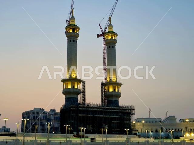 Mecca, Saudi Arabia, June 5 2024: Minarets of Al Masjid Al Haram mosque around the Kaaba in Hajj, pilgrimage, Umrah, with crane towers around it for m