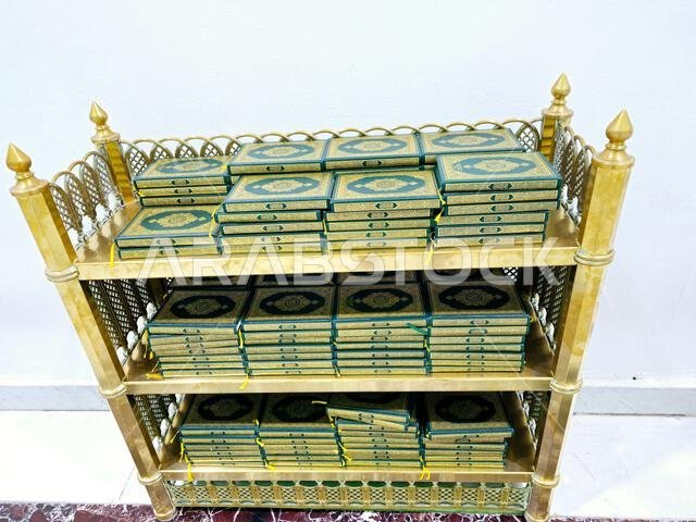 Translation of the Arabic text (Holy Quran), Stacks of holy Quran book, Islamic Noble Koran, Inside Al Masjid Al Haram mosque in Mecca Makkah city, (t
