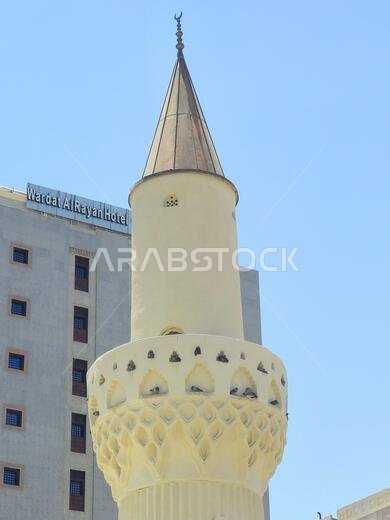 Medina, Saudi Arabia, June 26 2024: Minaret of The Abu Bakr Mosque, Masjid Abo Bakr As-Siddiq, one of the oldest mosques in Madinah, located towards t