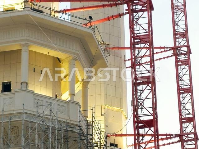 Mecca, Saudi Arabia, June 4 2024: Minarets of Al Masjid Al Haram mosque around the Kaaba in Hajj, pilgrimage, Umrah, with crane towers around it for m Mecca, Saudi Arabia, June 4 2024: Minarets of Al Masjid Al Haram mosque around the Kaaba in Hajj, pilgrimage, Umrah, with crane towers around it for m