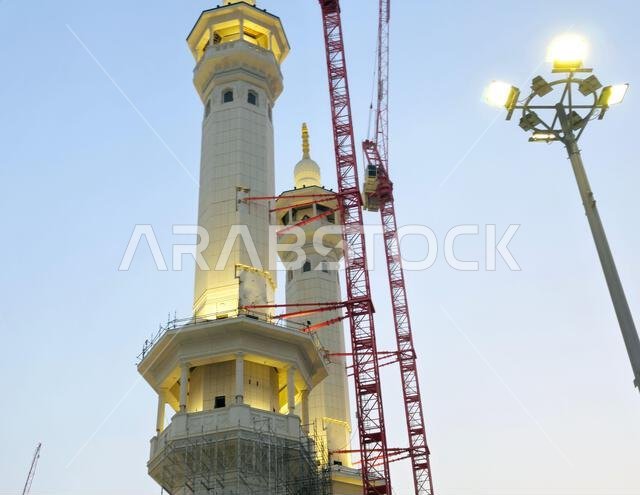 Mecca, Saudi Arabia, June 4 2024: Minarets of Al Masjid Al Haram mosque around the Kaaba in Hajj, pilgrimage, Umrah, with crane towers around it for m