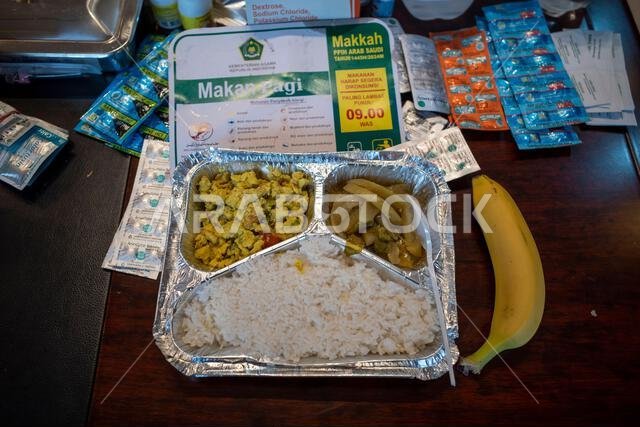 Mecca, Saudi Arabia - June 7, 2024: Breakfast menu for Hajj and Umrah pilgrims from Indonesia in Mecca, Saudi Arabia. Hajj 2024. Mecca, Saudi Arabia - June 7, 2024: Breakfast menu for Hajj and Umrah pilgrims from Indonesia in Mecca, Saudi Arabia. Hajj 2024.
