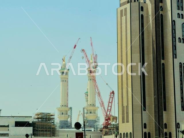 Mecca, Saudi Arabia, June 4 2024: Minarets of Al Masjid Al Haram mosque around the Kaaba in Hajj, pilgrimage, Umrah, with crane towers around it for m