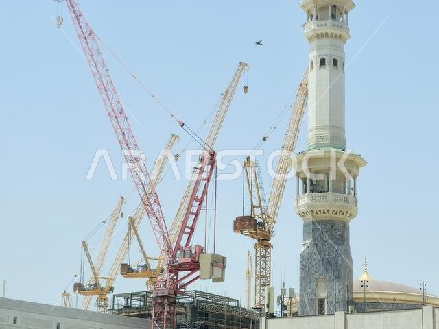 Mecca, Saudi Arabia, June 4 2024: Minarets of Al Masjid Al Haram mosque around the Kaaba in Hajj, pilgrimage, Umrah, with crane towers around it for m