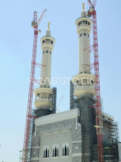 Mecca, Saudi Arabia, June 4 2024: Minarets of Al Masjid Al Haram mosque around the Kaaba in Hajj, pilgrimage, Umrah, with crane towers around it for m