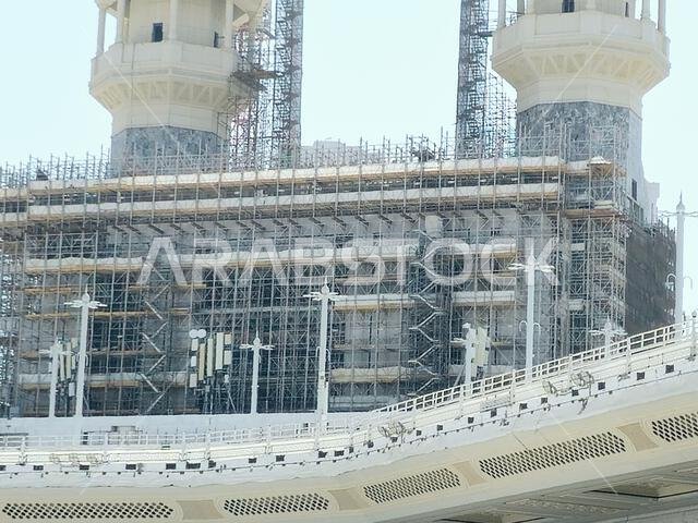 Mecca, Saudi Arabia, June 4 2024: Minarets of Al Masjid Al Haram mosque around the Kaaba in Hajj, pilgrimage, Umrah, with crane towers around it for m