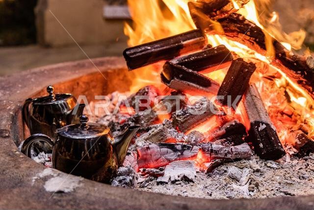 Tea pots on a fire in Saudi Arabia