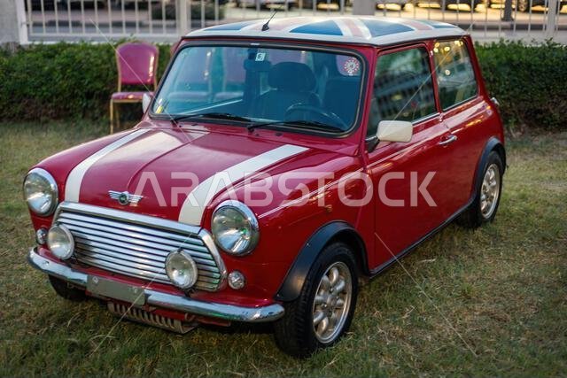Classic Charm on Display: Red Rover MINI Cooper at Dammam Exhibition, March 15, 2024