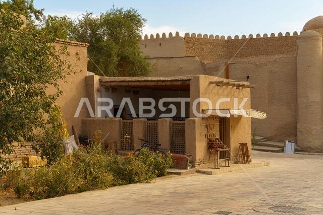 A small building with a porch and a sign that says "No Parking"