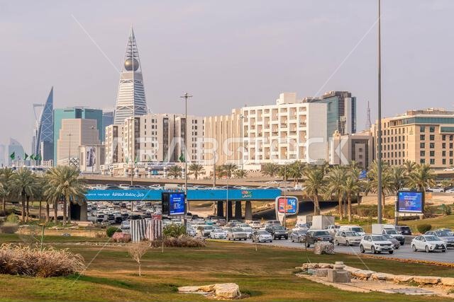 The traffic on Riyadh street, the capital of Saudi Arabia, with the city downtown, modern architecture and Al Faisaliah Tower skyscraper.