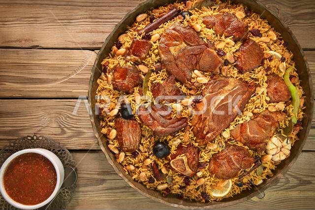 Arabic Cuisine; Lamb Kabsa is the most famous dish in Saudi cuisine, consisting mainly of cooked rice with some kind of meat and spices.