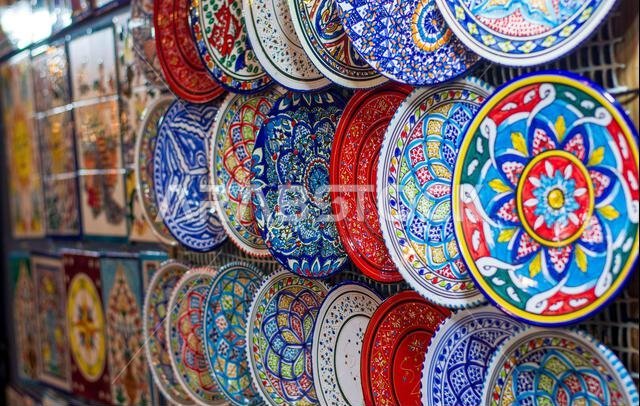 beautiful plates worked with natural colors on display in oriental markets