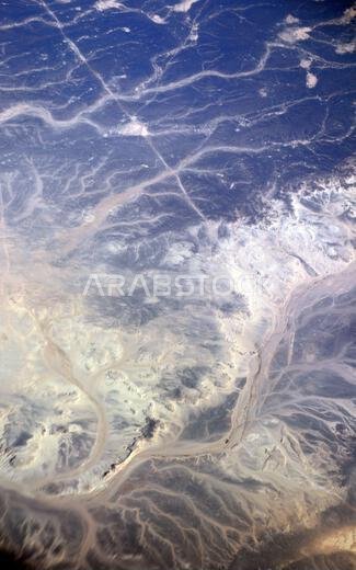 A Surreal aerial view of dried riverbeds in the desert in Jordan near the border with Saudi Arabia.