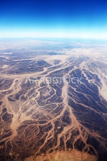 A Surreal aerial view of dried riverbeds in the desert in Jordan near the border with Saudi Arabia.