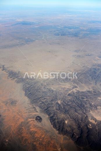 Aerial view of beautiful desert landscapes in the Qaraqir region in Saudi Arabia.