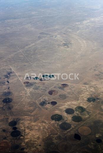 Center-Pivot circular farms in the Qaryat Al Ulya region in the Eastern province in Saudi Arabia.