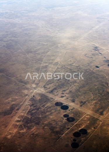 Center-Pivot circular farms in the Qaryat Al Ulya region in the Eastern province in Saudi Arabia.