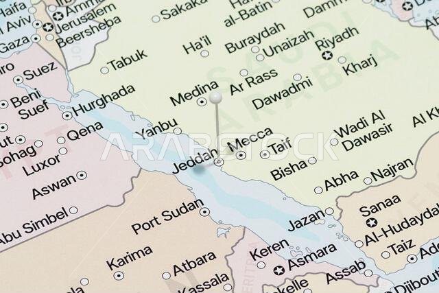 Macro photo of a white pin needle into Jeddah city of Saudi Arabia political map