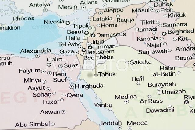 Macro photo of a white pin needle into Tabuk city of Saudi Arabia political map